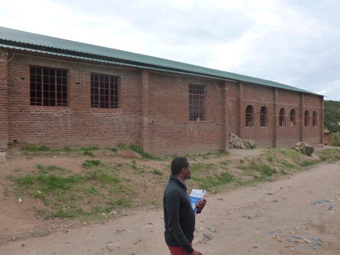 You can find such buildings quite frequently in the low-income areas. At first, I thought it's unfinished buildings. But actually it's churches! Windows are expensive, so they just go without.