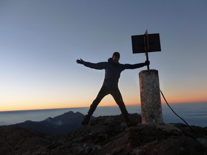 This picture does not really convey how windy it was. Grabbing the pole was definitely necessary to not get blown away.